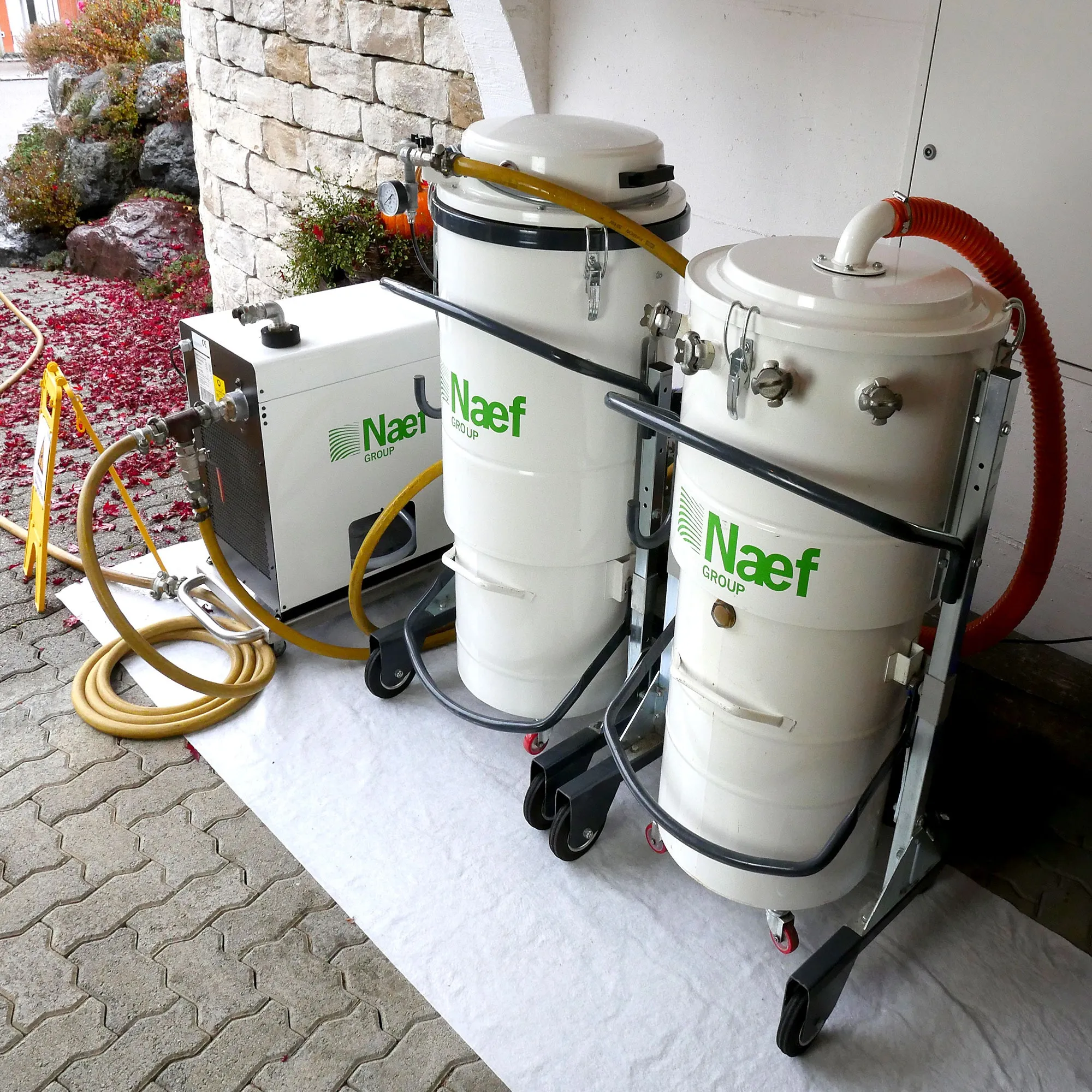 A couple of white tanks sitting next to each other.