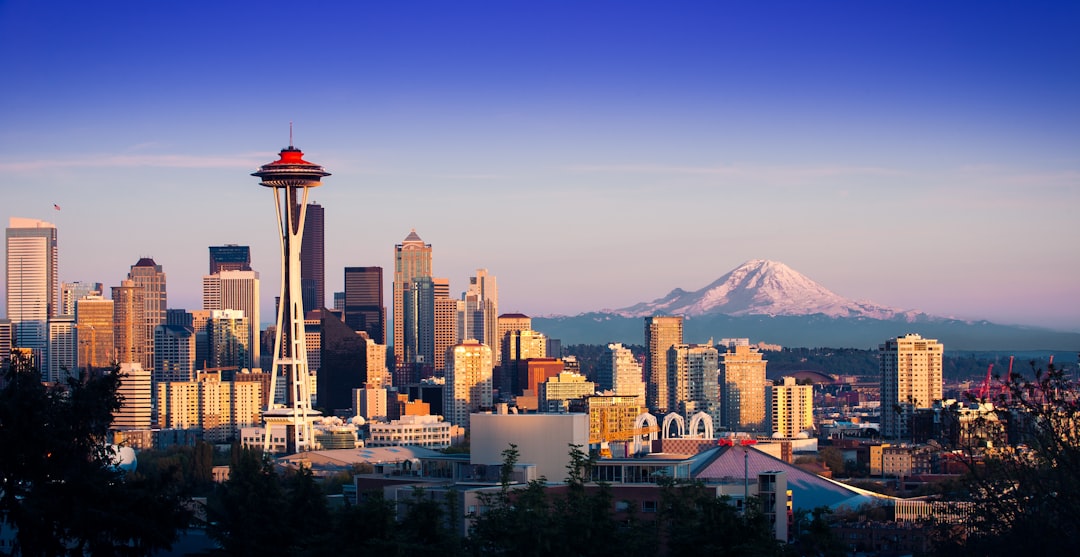 Seattle skyline with Space Needle and Mount Rainier at sunset