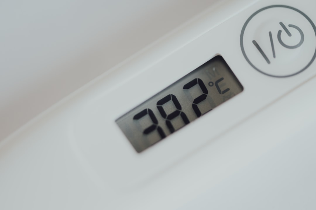 Digital thermometer showing 38.2 degrees Celsius