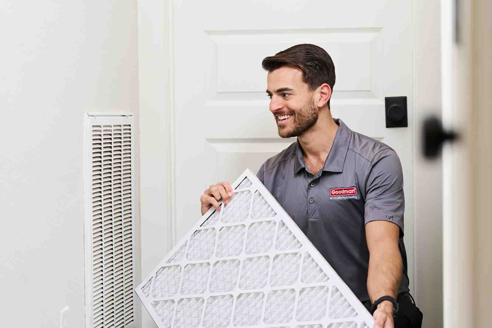 homeowner easily replacing a furnace filter - hvac maintenance seattle wa homeowner easily replacing a furnace filter - hvac maintenance seattle wa