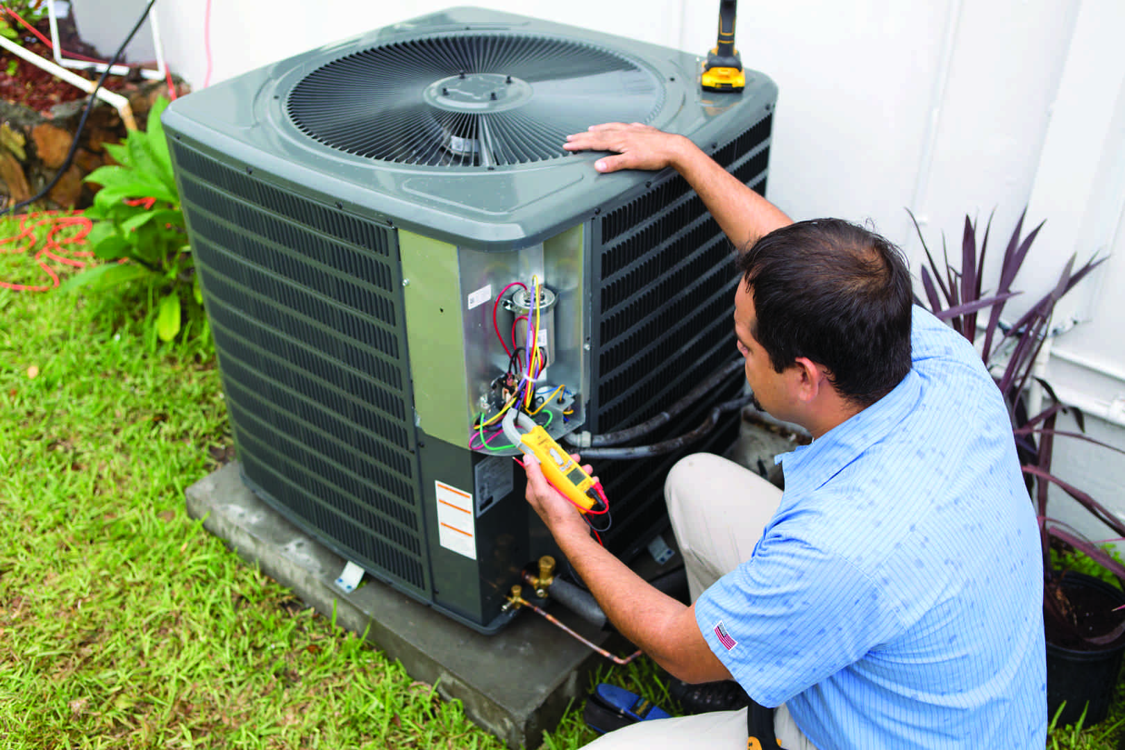 technician servicing an outdoor heat pump unit - hvac maintenance seattle wa technician servicing an outdoor heat pump unit - hvac maintenance seattle wa