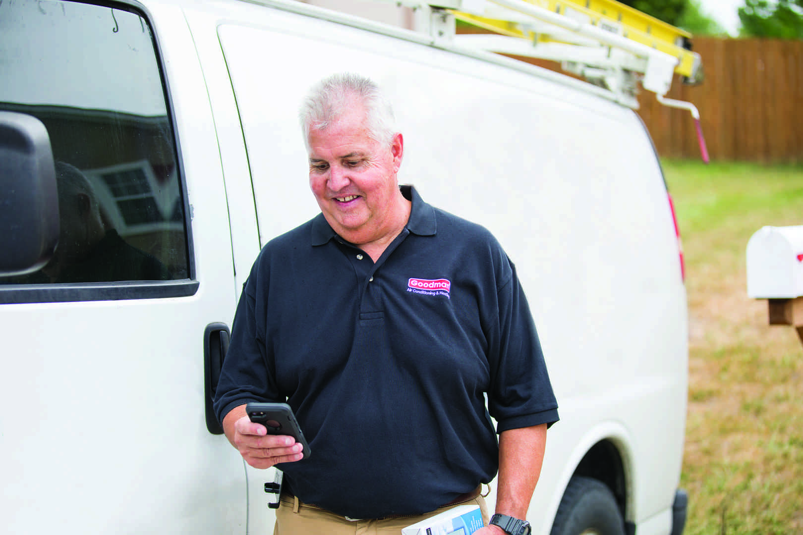 a clean, branded service van with a professional technician standing beside it - hvac inspection seattle wa