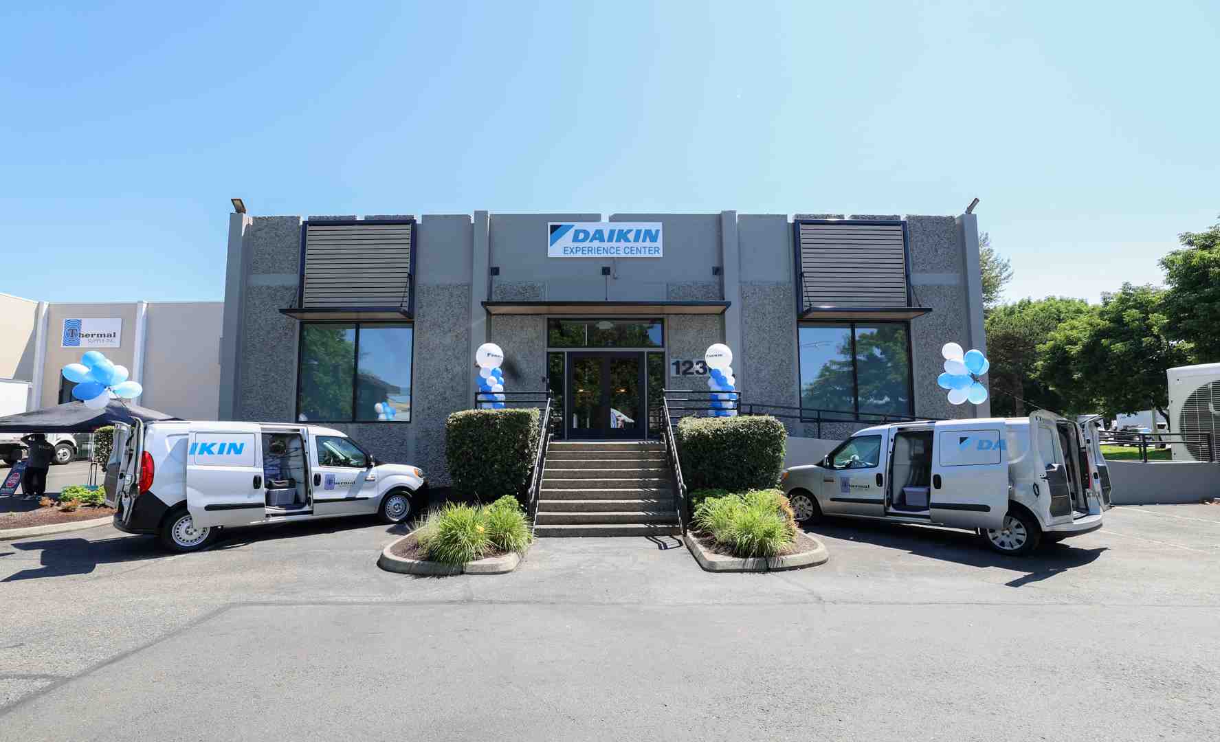 Daikin technician standing next to a clean service van in a Seattle neighborhood - "Find the best-rated companies for furnace repair in Seattle." Daikin technician standing next to a clean service van in a Seattle neighborhood - "Find the best-rated companies for furnace repair in Seattle."
