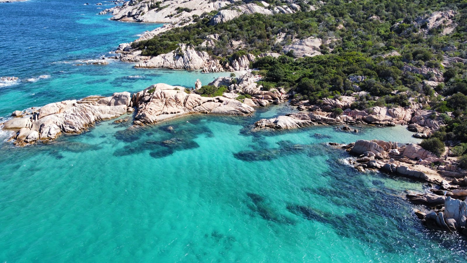 Turquoise water lapping against a rocky seashore on the Cyprus coast