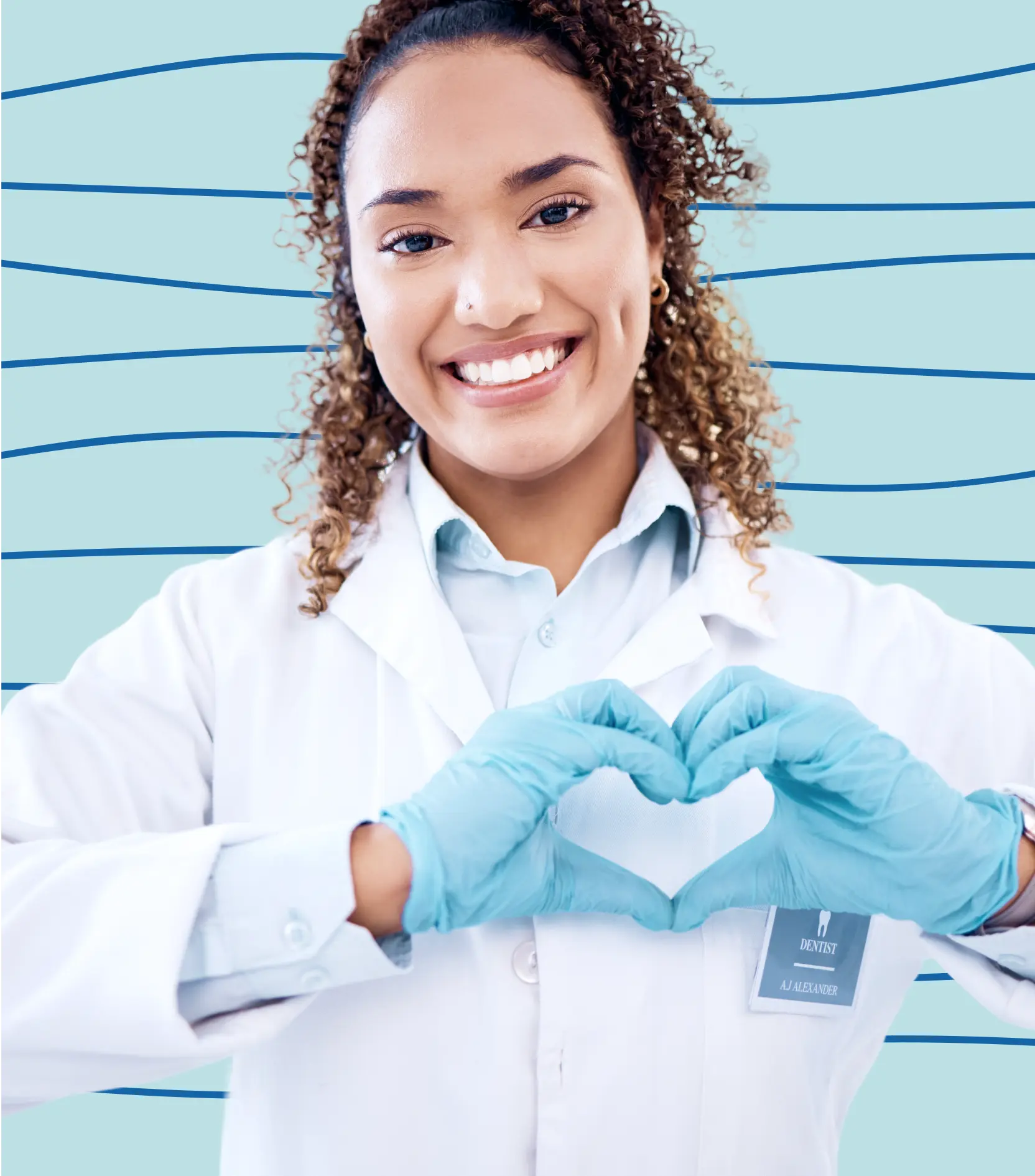 Image of a dentist smiling wide while making a heart with her fingers