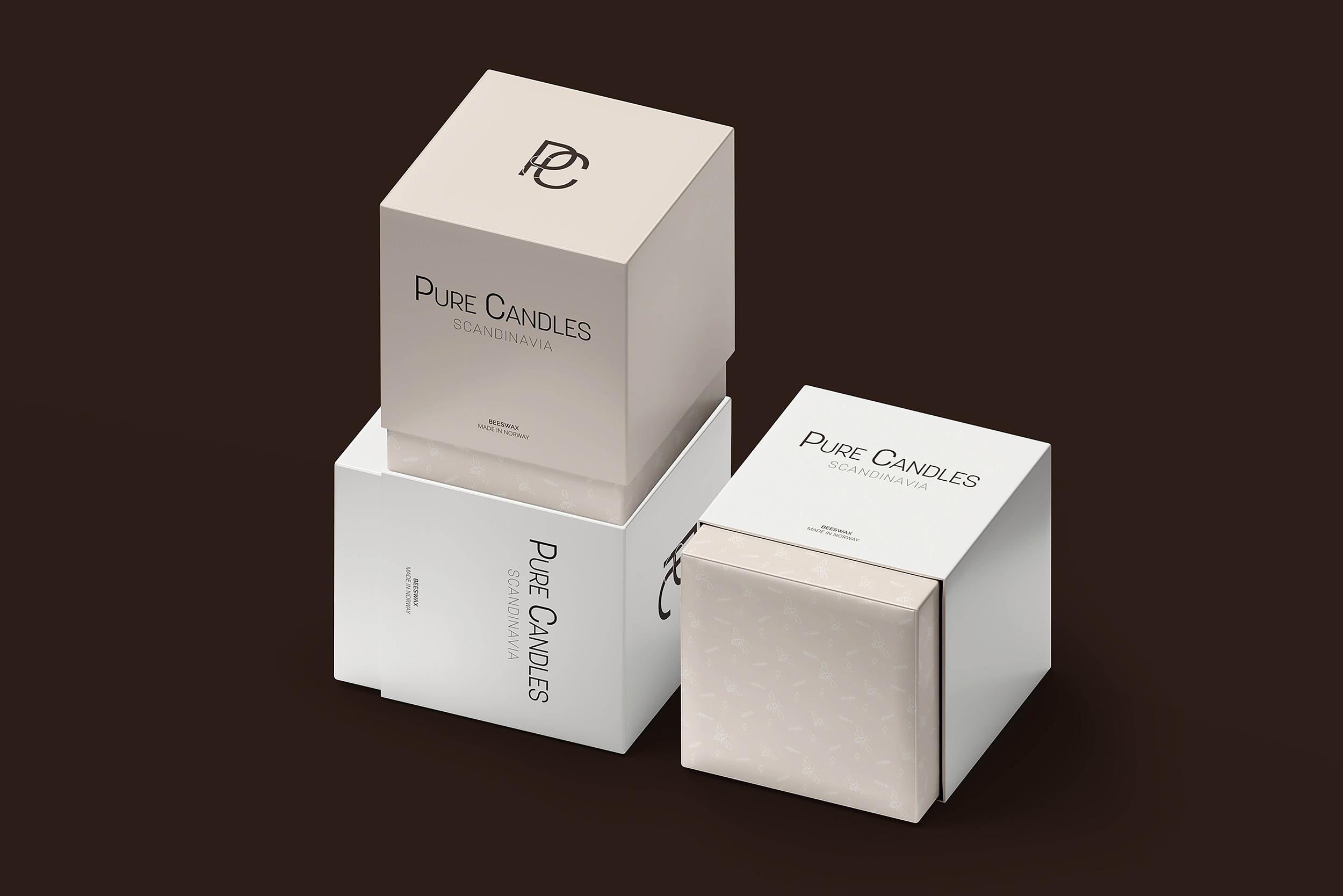 Three Pure Candles boxes are displayed against a dark brown background.