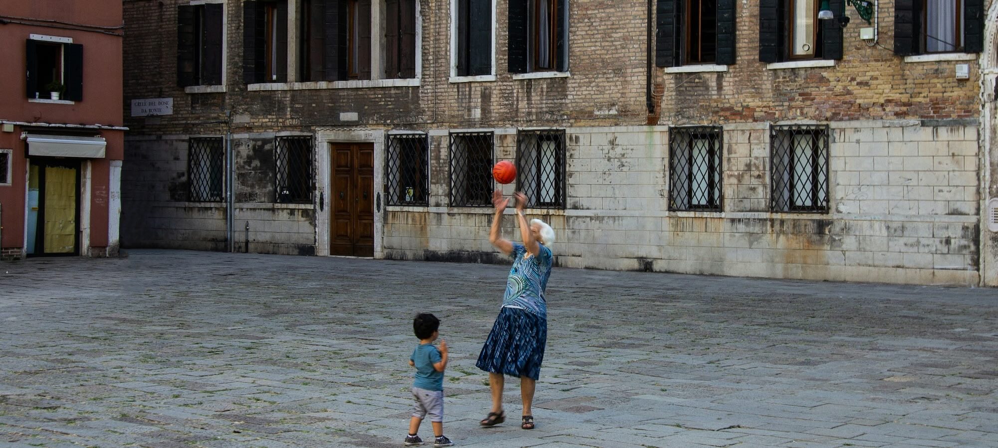 Boy on a scooter in street