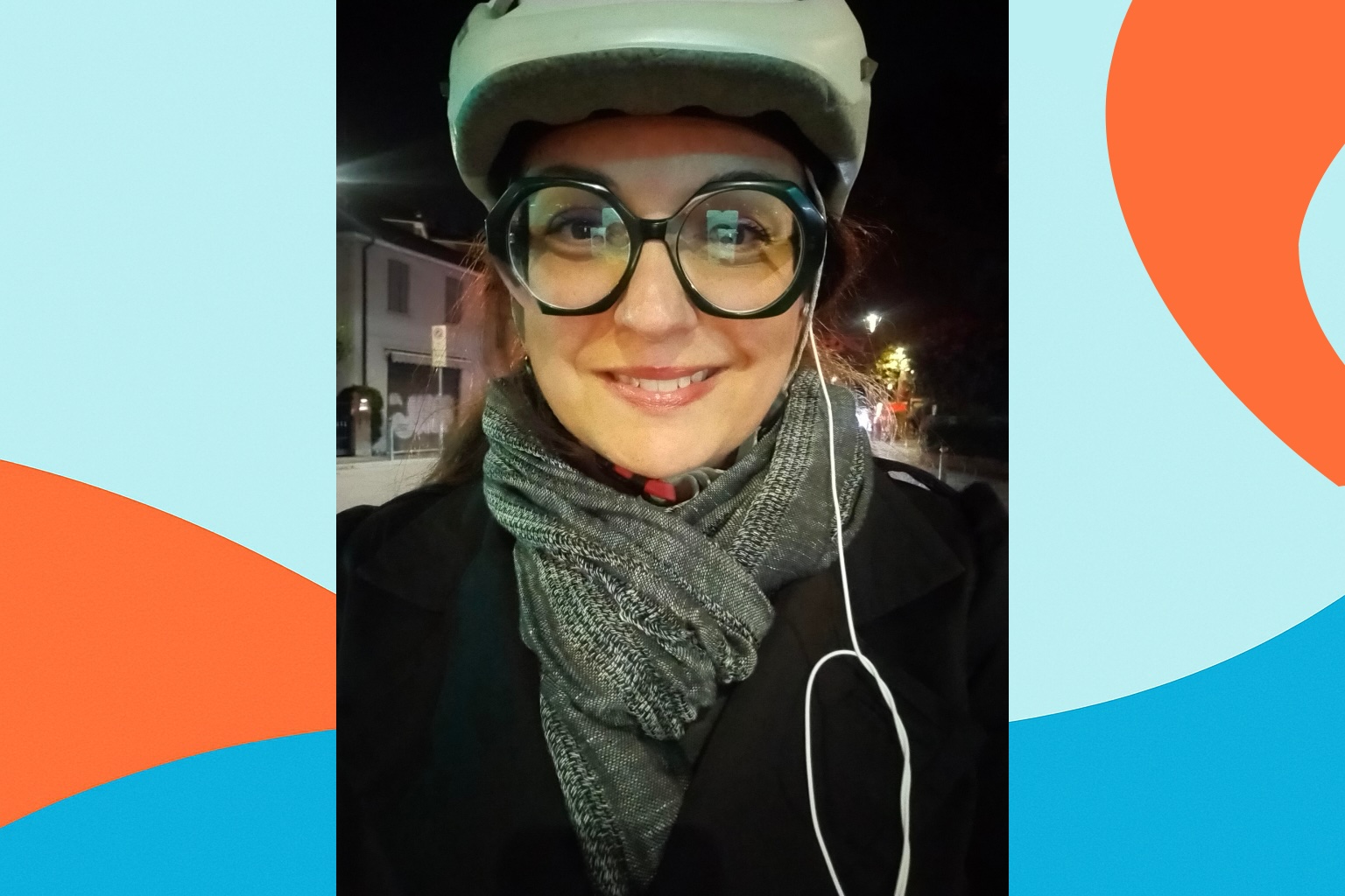 selfie of a person at night with a bike helmet