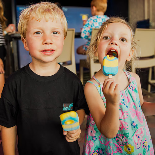 Kids enjoying popsicles inside the indoor play area at The Yard Ocean City NJ