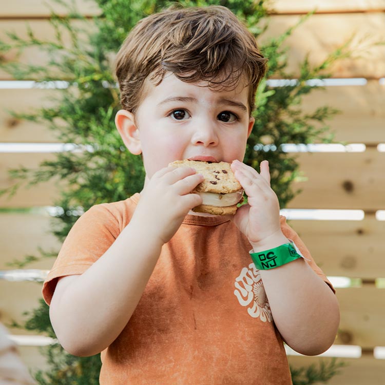 Child eating an ice cream sandwich during a summer day at The Yard Ocean City NJ