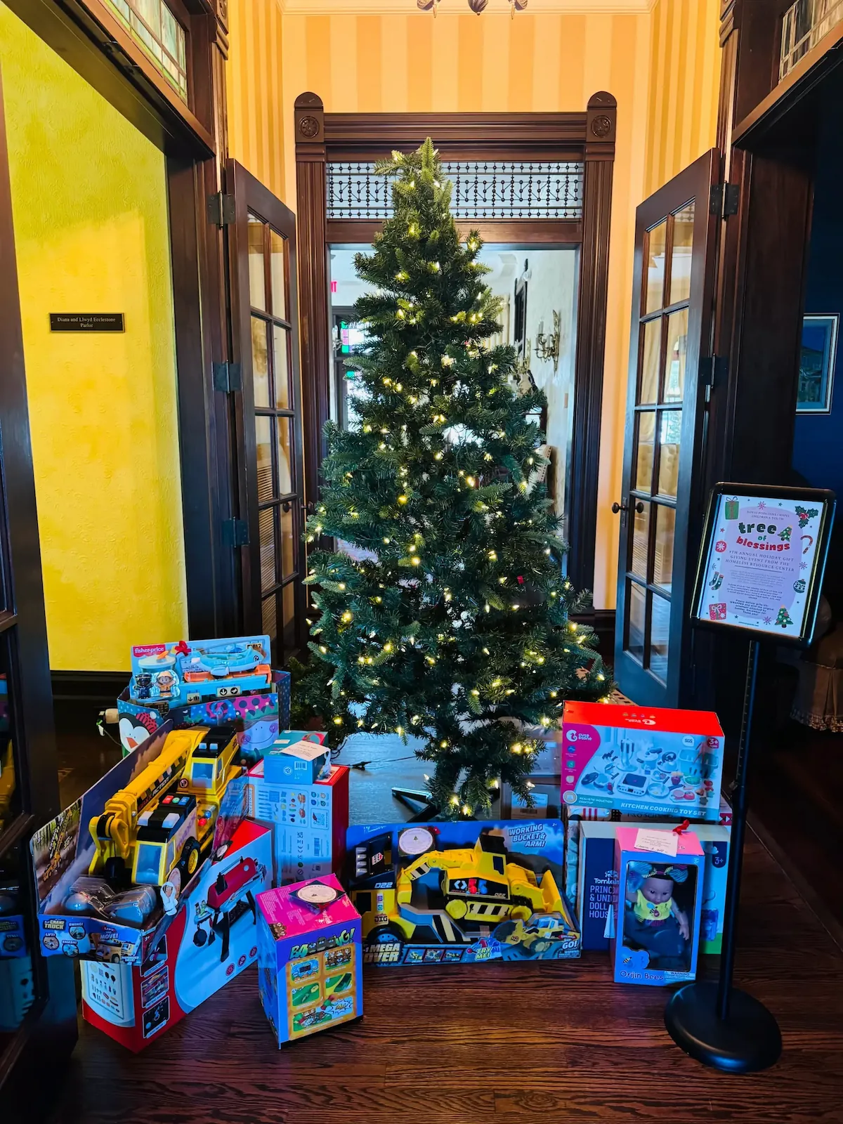 toys under a decorated Christmas tree