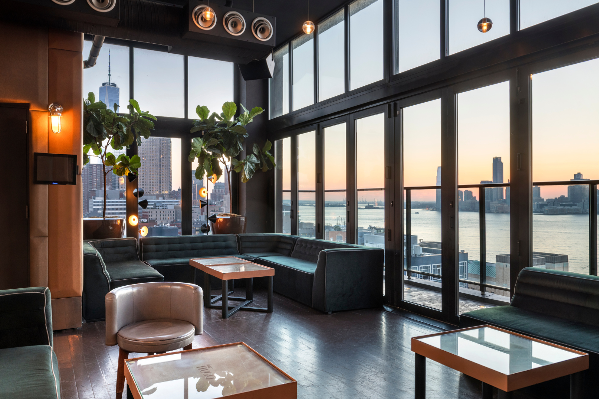 The interior of Hotel Hugo with a view of the city.