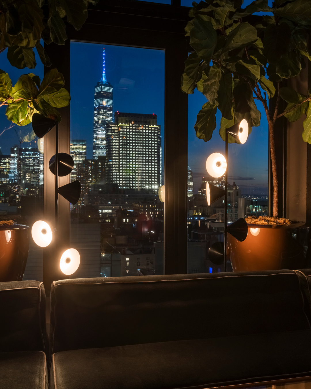 Meeting room at Hotel Hugo SoHo NYC with conference table, modern AV setup, and natural light