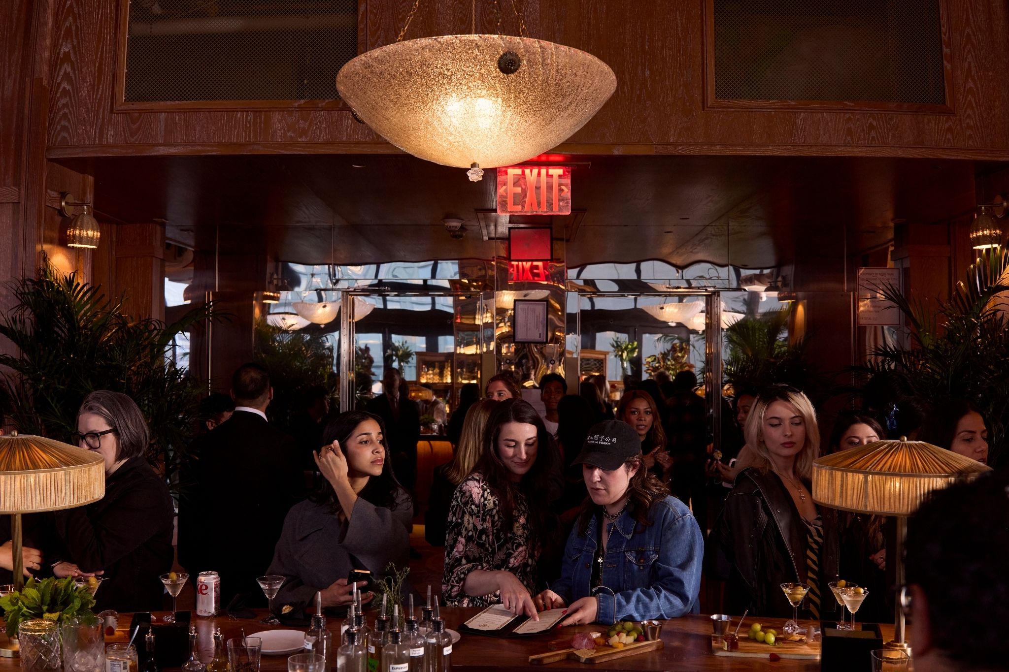 Elegant bar with dim lighting, colorful cocktails, and a cozy nighttime vibe.