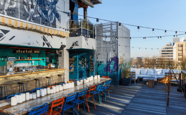 Hotel Hugo NYC rooftop under a clear blue sky during NYC Summer Restaurant Week 2026, offering rooftop dining and panoramic Manhattan views.