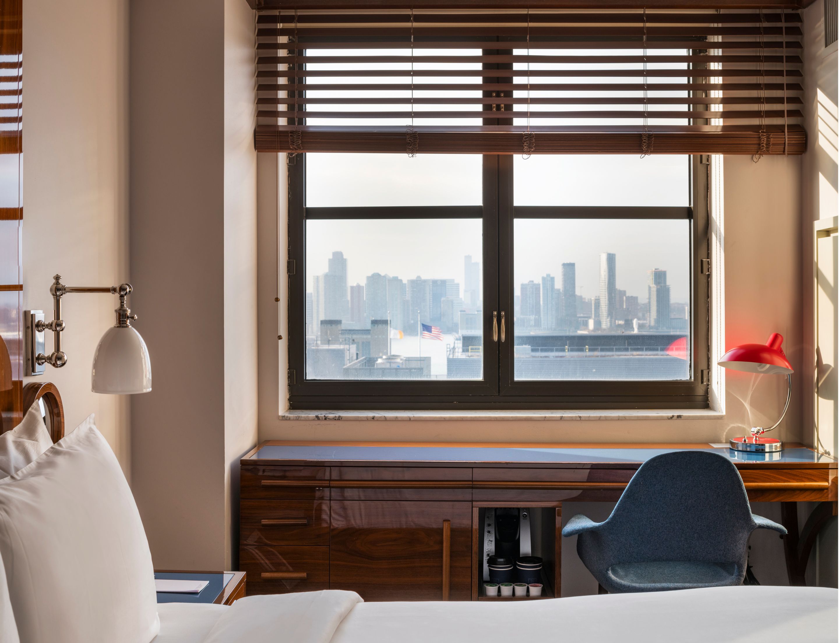 Guest room at Hotel Hugo SoHo NYC with contemporary design, soft bedding, and warm lighting
