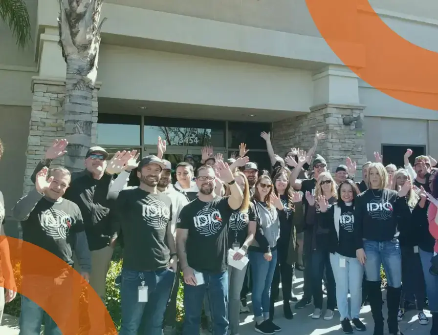 IDIQ employees waving