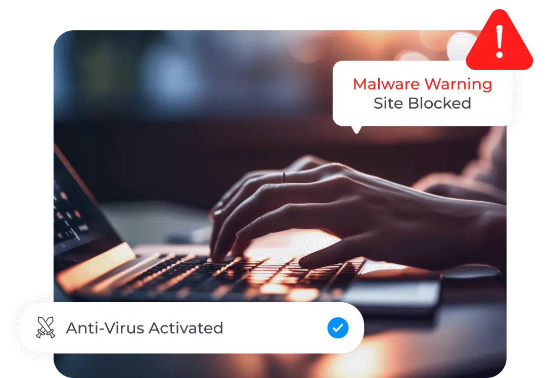 A person's hands are typing on a laptop keyboard in a dimly lit environment. A warning message on the screen says, "Malware Warning: Site Blocked," and a notification at the bottom left reads, "Anti-Virus Activated" with a checkmark icon, emphasizing the importance of identity theft protection.