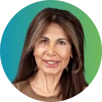 A portrait of a smiling woman with long, straight brown hair featuring light streaks. She is wearing a brown top. The background is a gradient of blue and green, subtly enhancing the overall composition.