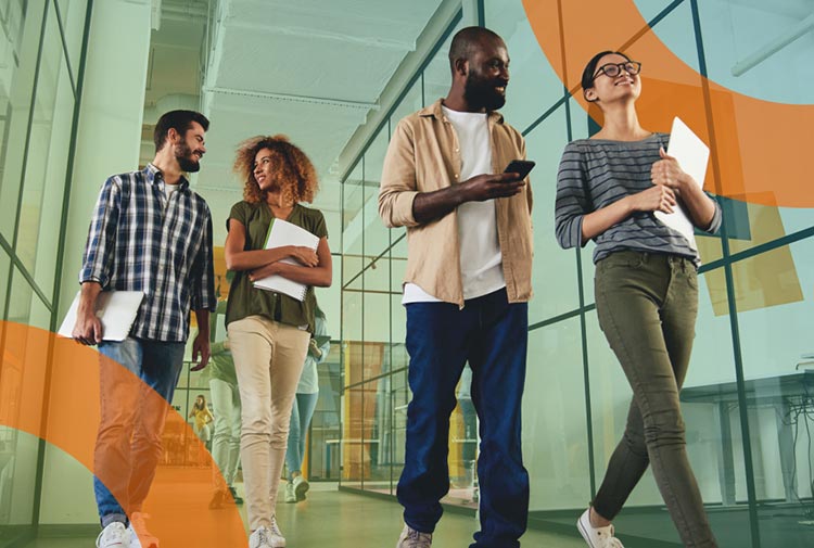 happy coworkers walking through office