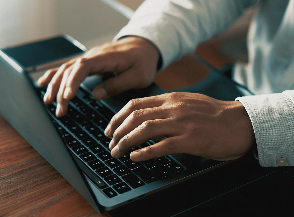 A businessman typing on his laptop