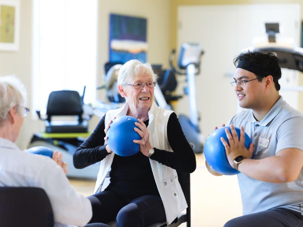 senior excising in a senior retirement home