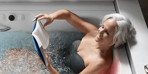 A close-up of the Kohler Bask heated backrest, designed to provide soothing warmth to the upper body.