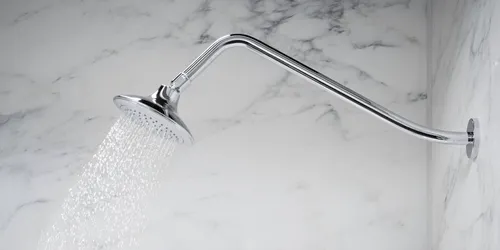 A close-up of a gooseneck shower arm, showcasing its elegant curve and sturdy construction.