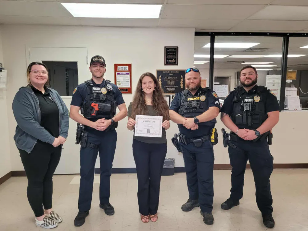 2025 Scholarship winner Ava Martinez with officers and woman