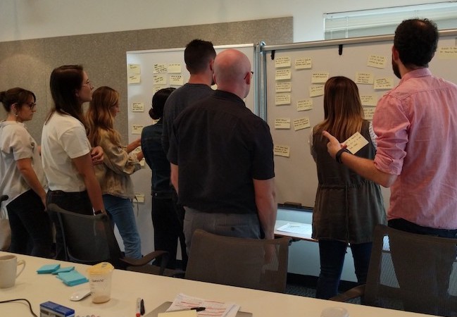 UX designers and product managers participate in a user research and prototyping training workshop