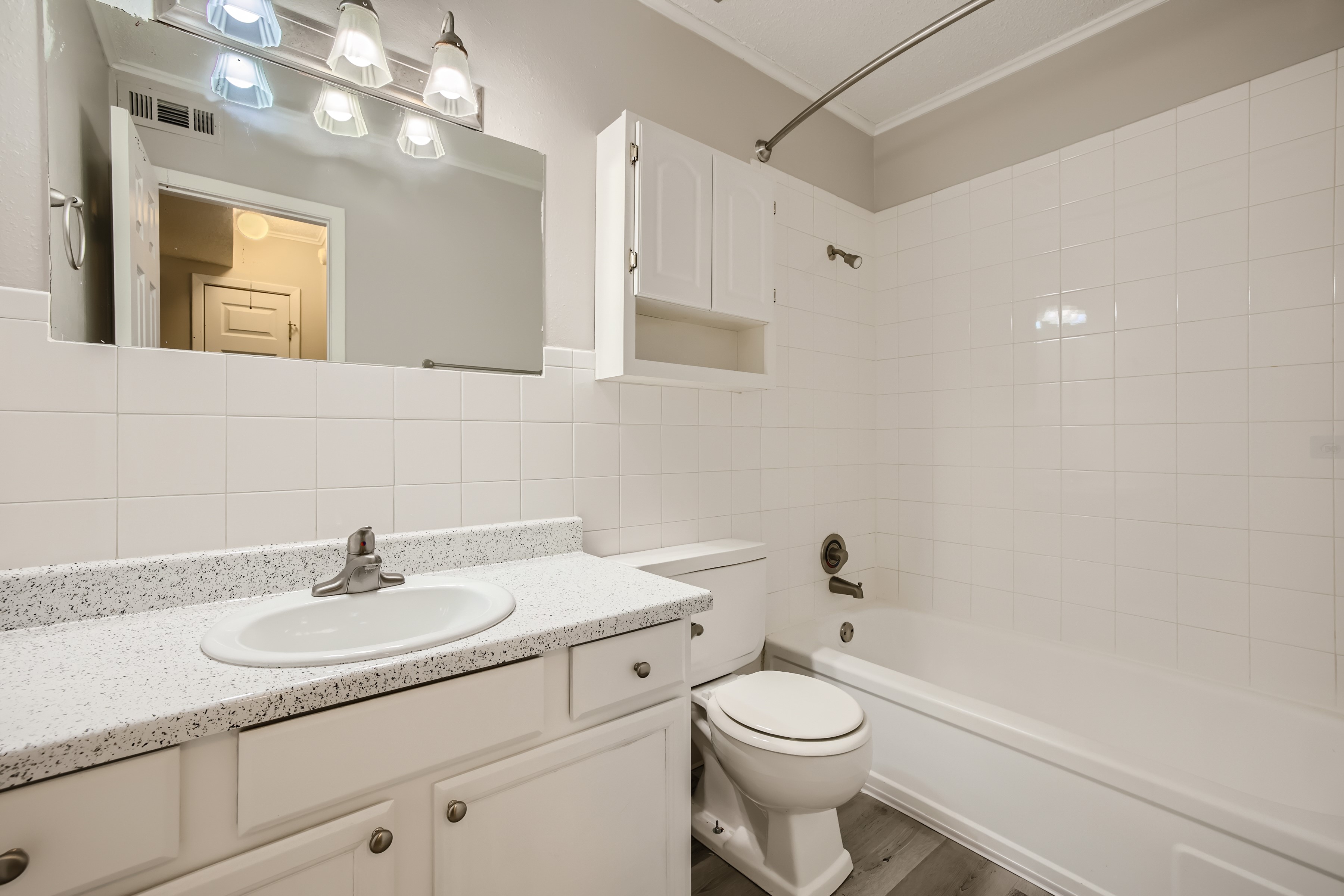 Updated bathroom with white vanity