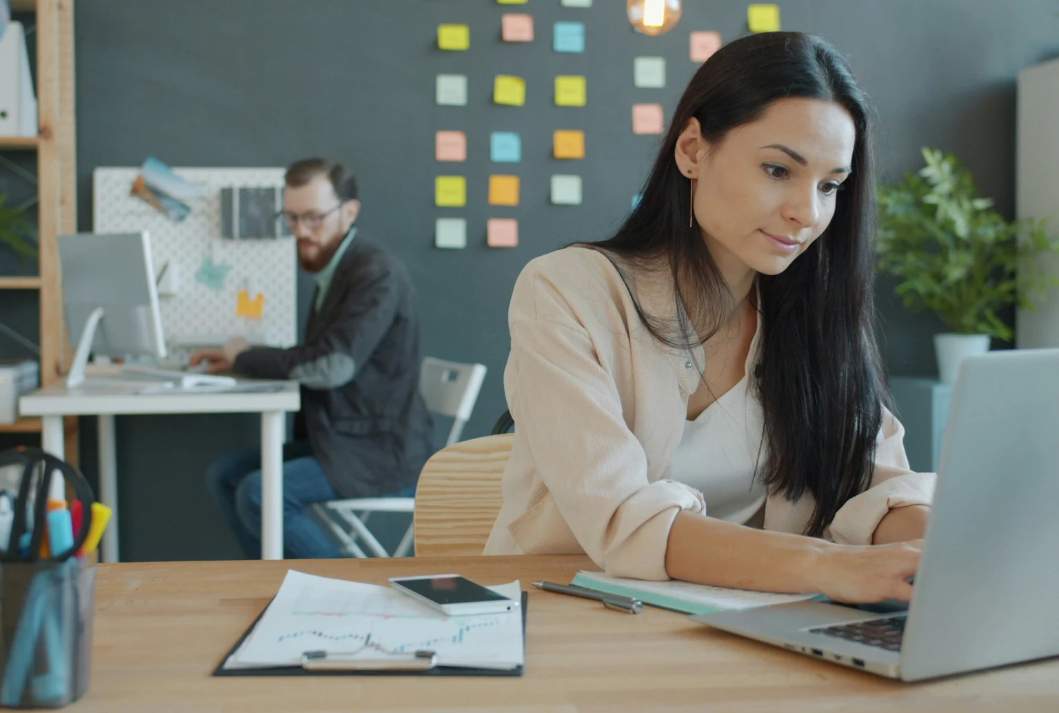 Business team comparing CRM software options in a modern office