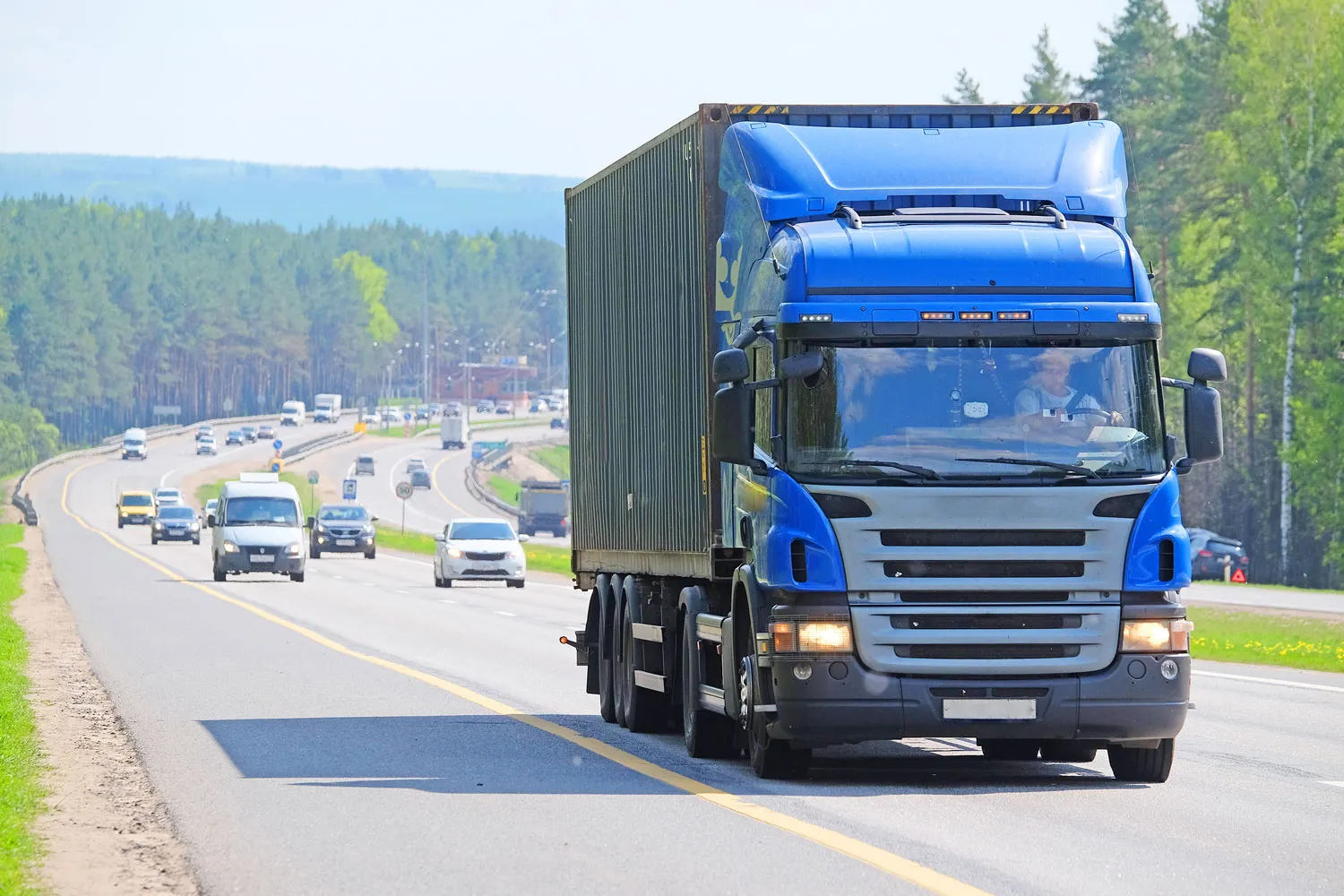 Truck on the highway transporting automotive spare parts, illustrating the logistics and transportation of auto components