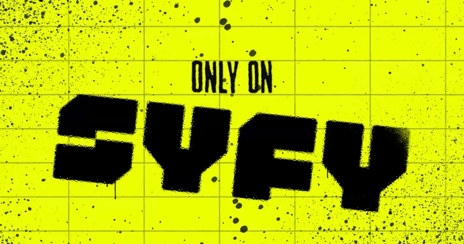 Bold black graffiti text reading 'ONLY ON SYFY' on a yellow tiled background with black paint splatters.