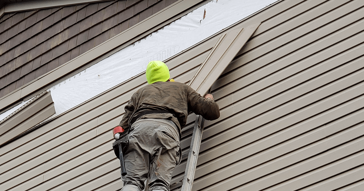 Siding on a house being replaced by Brothers Who Roof and Construction