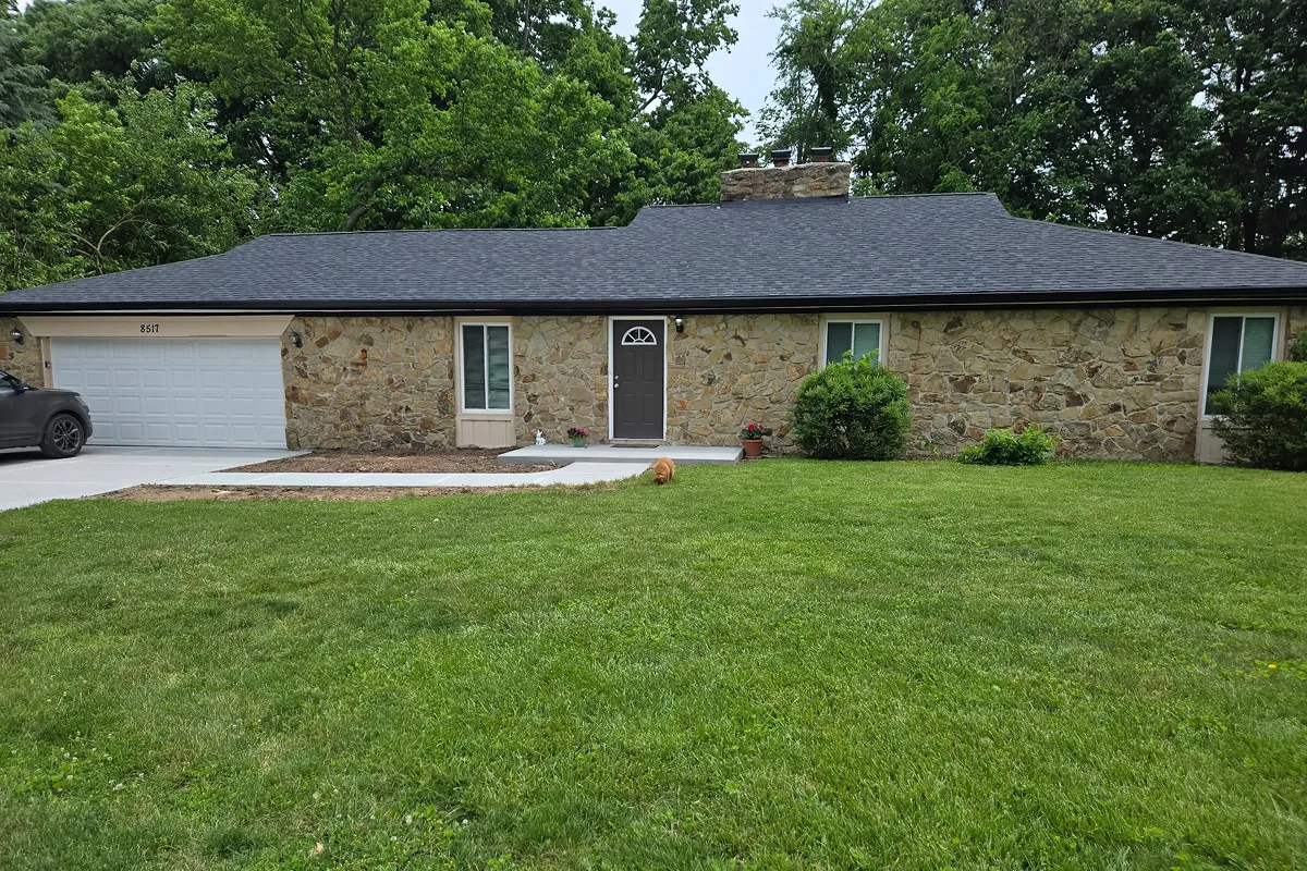 New black asphalt roof and new gutters for Johnson County homeowner customer