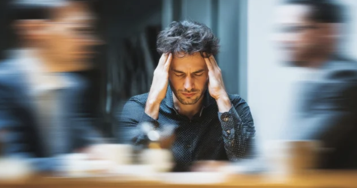 Business owner experiencing deal fatigue during a lengthy M&A negotiation process.