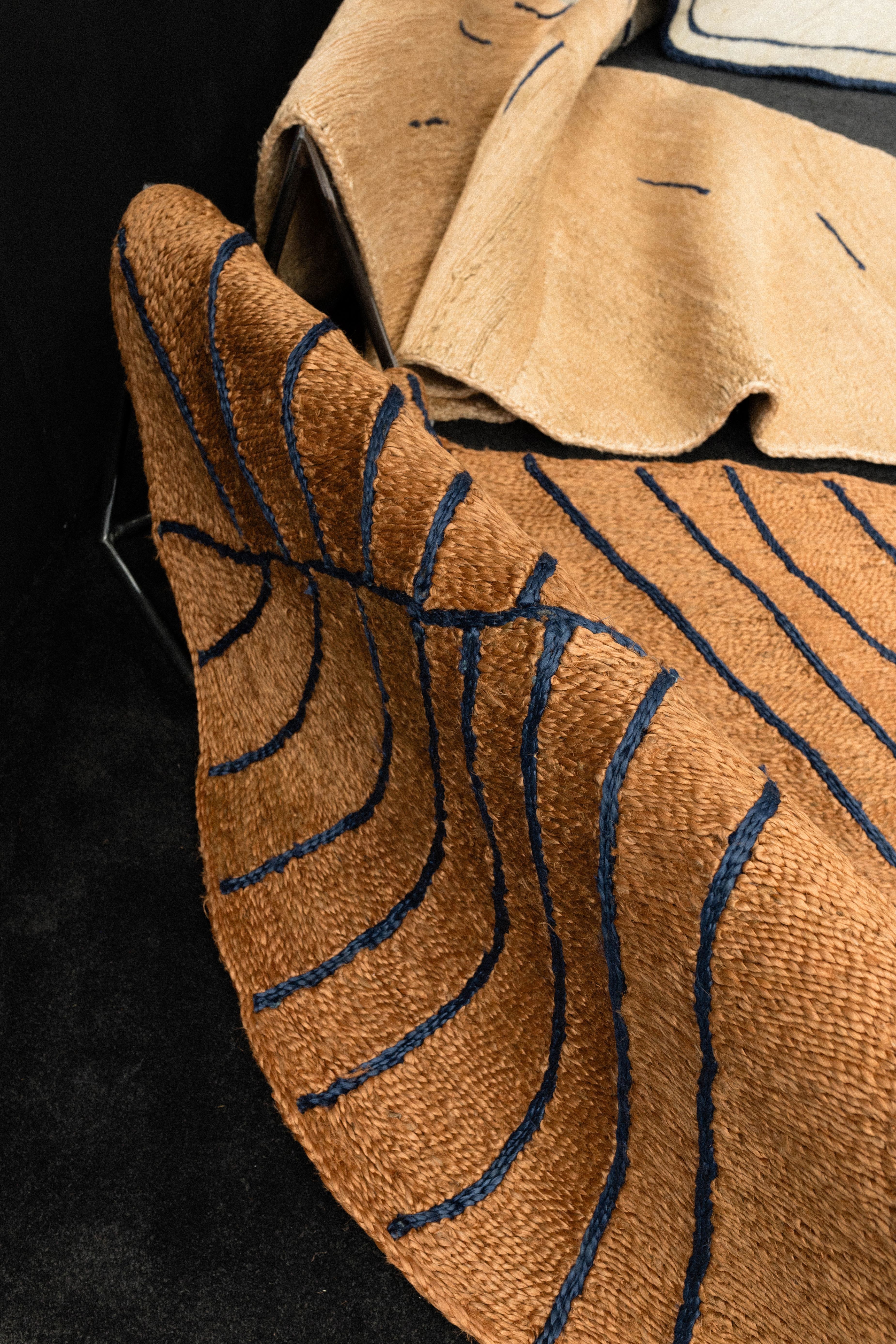 A photo of Jiko II (Golden tan and ink blue) and Ala I (Blonde earth and ink blue)