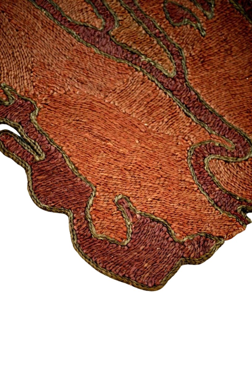 a decorative jute rug designed by Kelechi Ejikeme for Swallo's GBO II collection