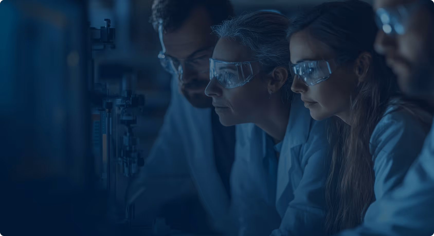  the professional scientific setting, the protective equipment, and the collaborative nature of the work - which aligns well with your Momentum Lab2Biz content about supporting science-driven startups and research commercialization.