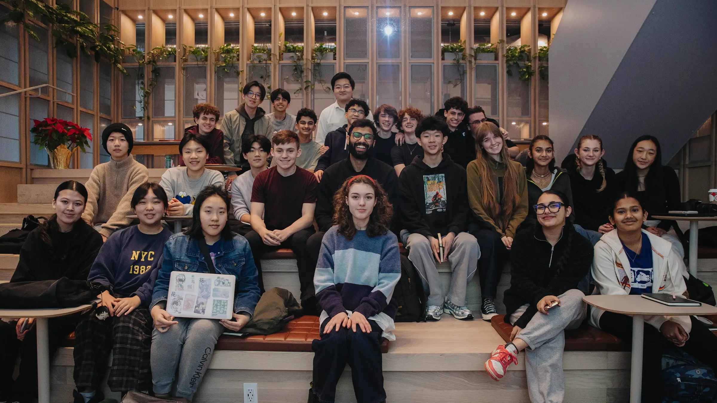 a photo of students with the teacher in the classroom
