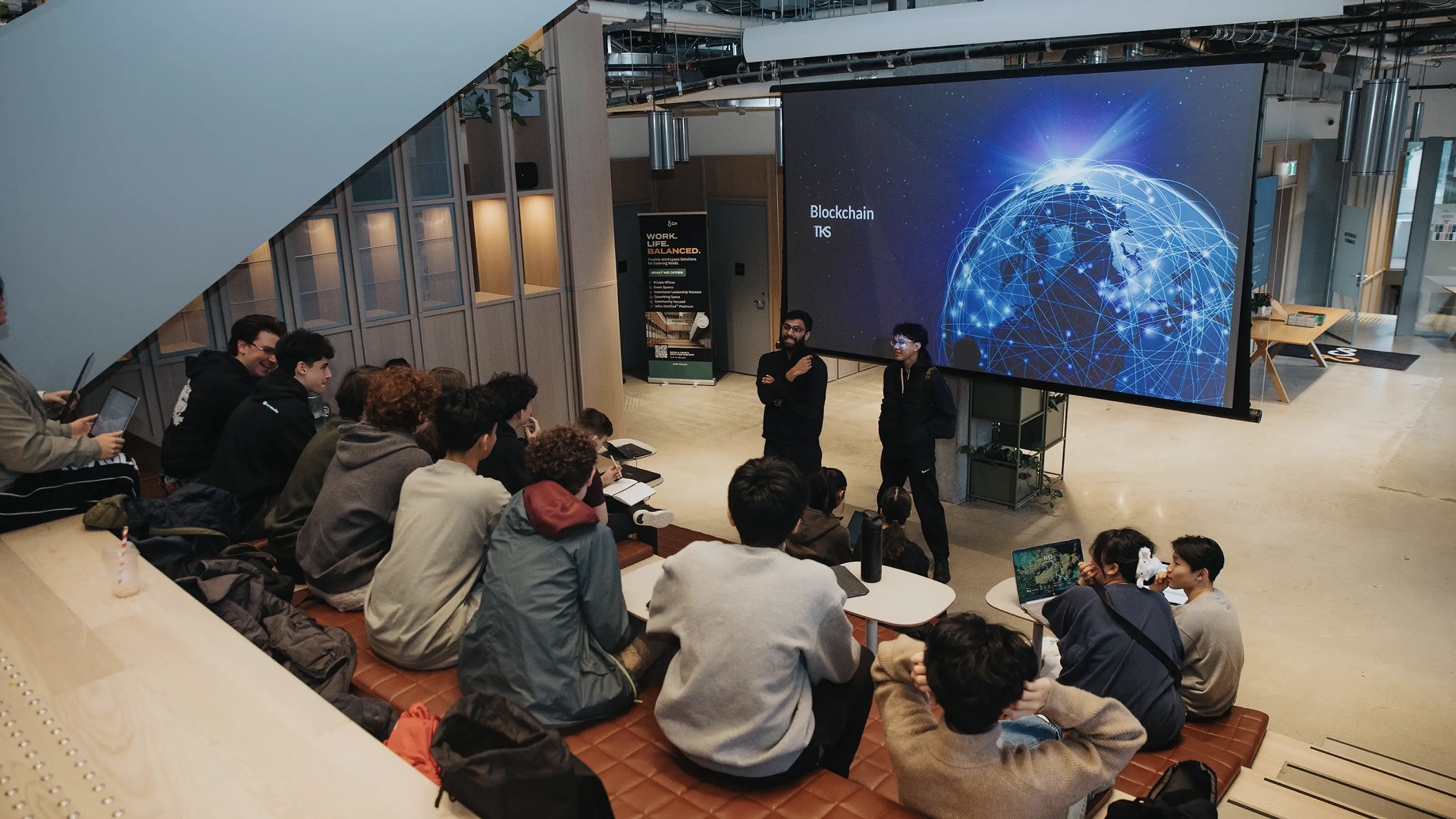 lecture in a large-screen auditorium