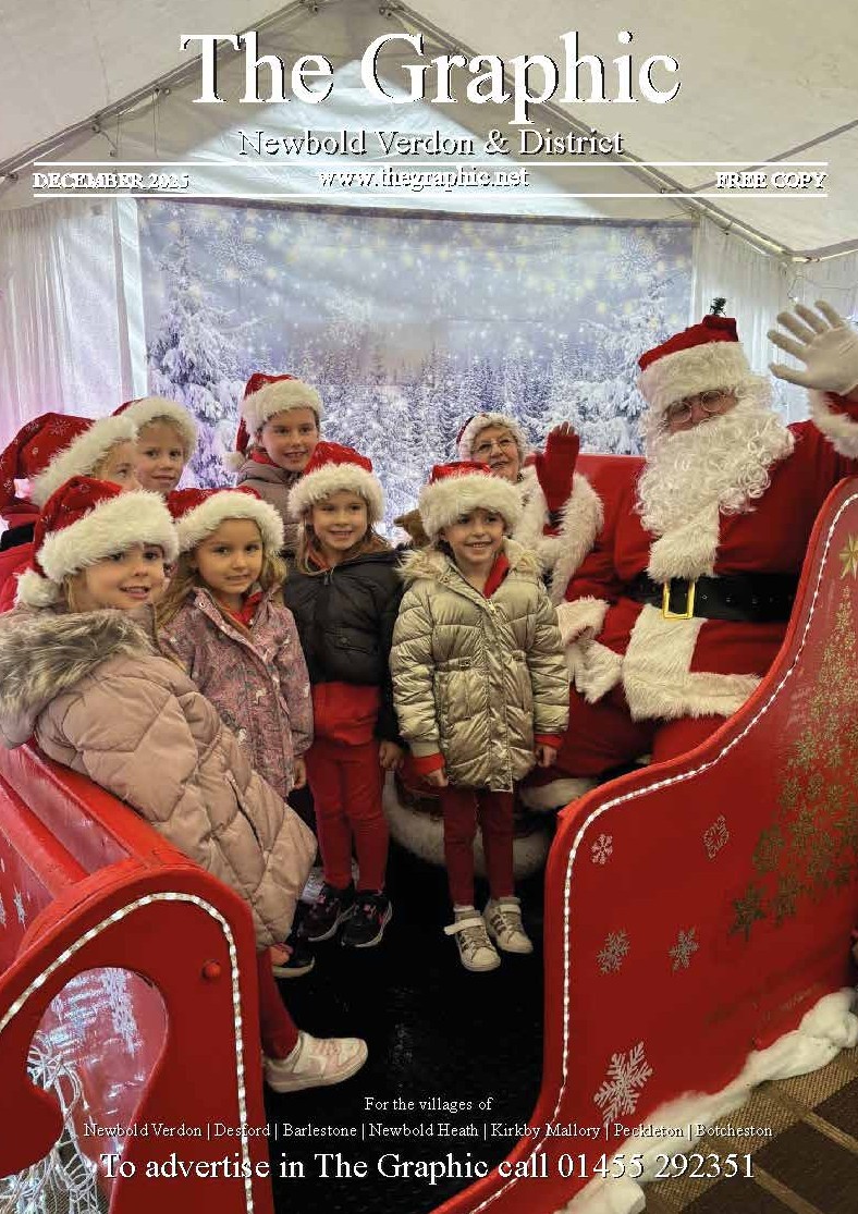 Children wearing Santa hats sitting with Santa Claus and Mrs. Claus inside a festive tent with a snowy winter backdrop.