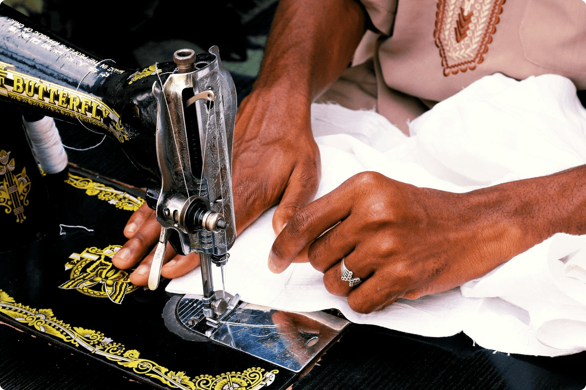 A woman sewing on a machine
