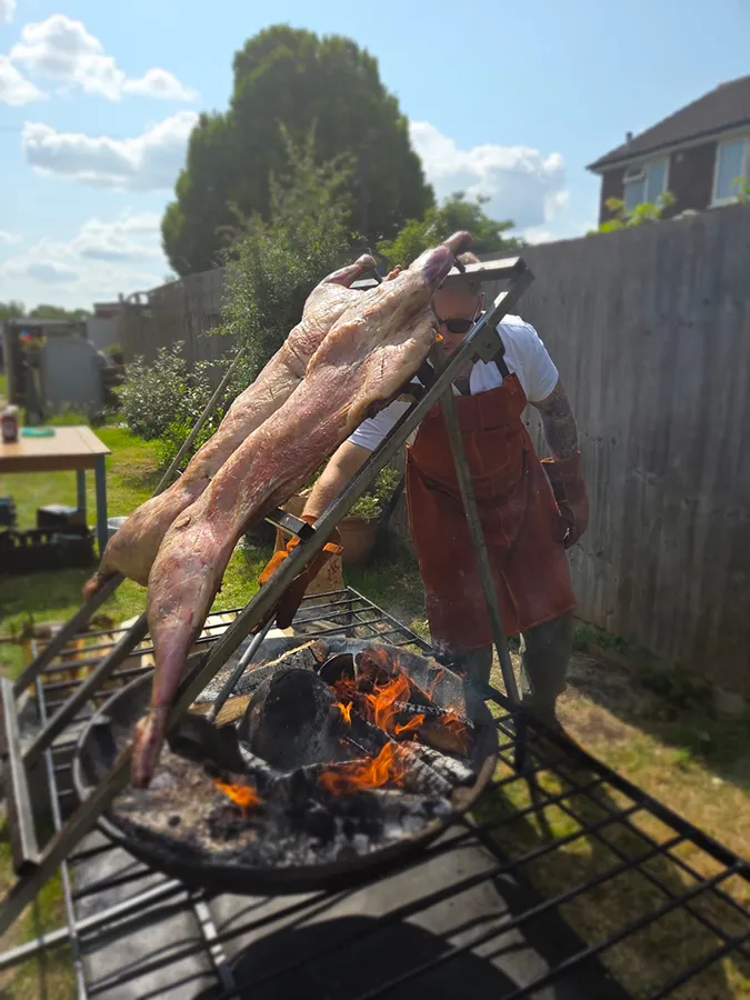 Slow-roasted kebabs sizzling over open flame on parrilla grill