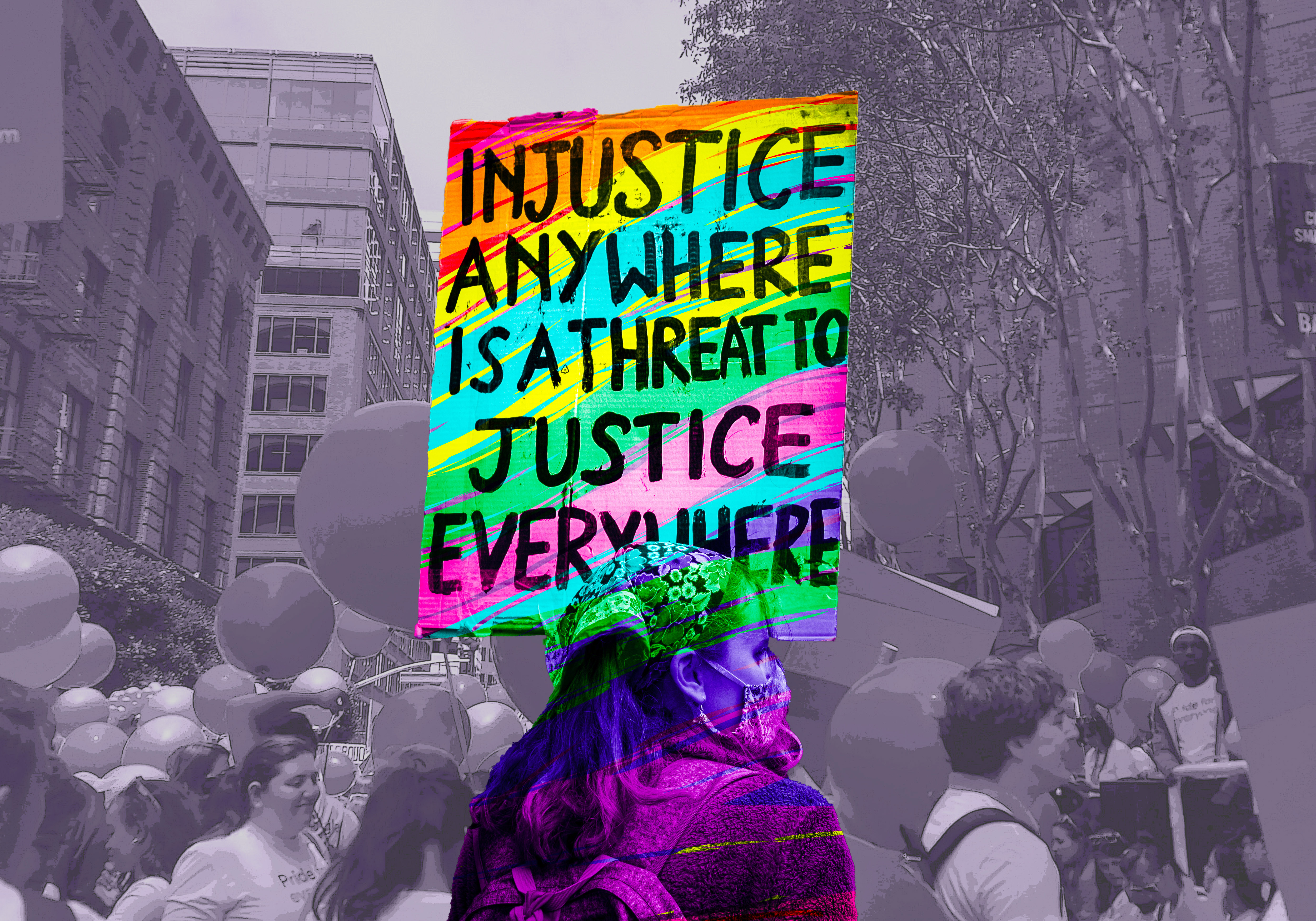 A single woman stands with a cardboard sign saying, "Injustice anywhere is a threat to justice anywhere," with the colors of the Gilbert Baker pride flag overlaid on her. In the background is a black and white scene from the Google section of a Pride parade.