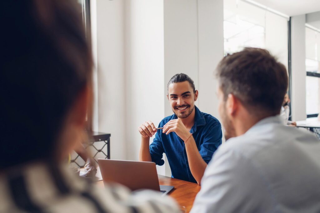 Engaged NDIS consultant listening to clients.