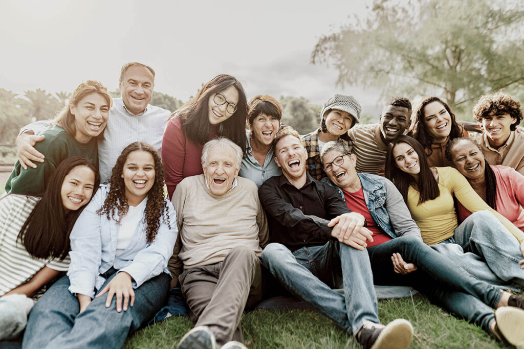 Joyful photo of a diverse group showing NDIS community support.