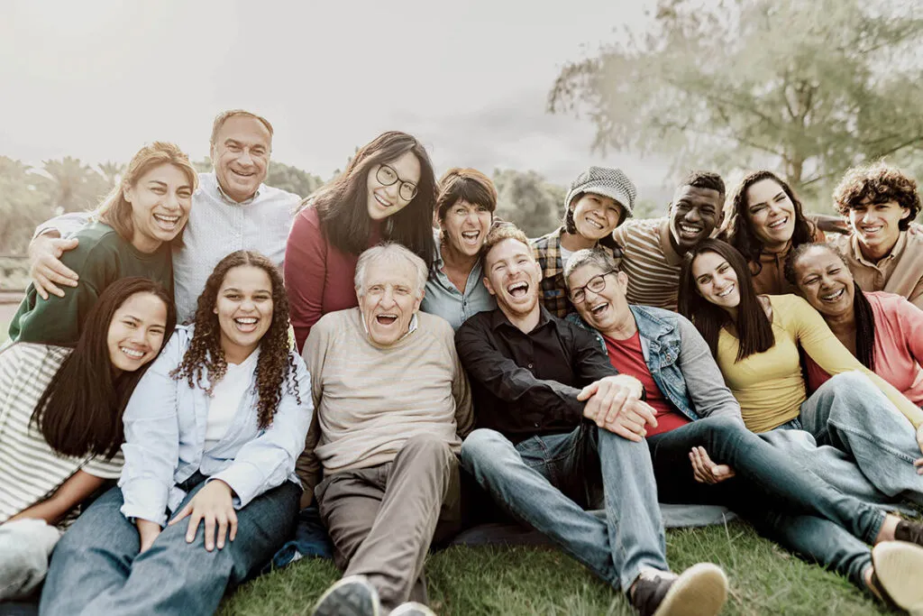 Joyful photo of a diverse group showing NDIS community support.