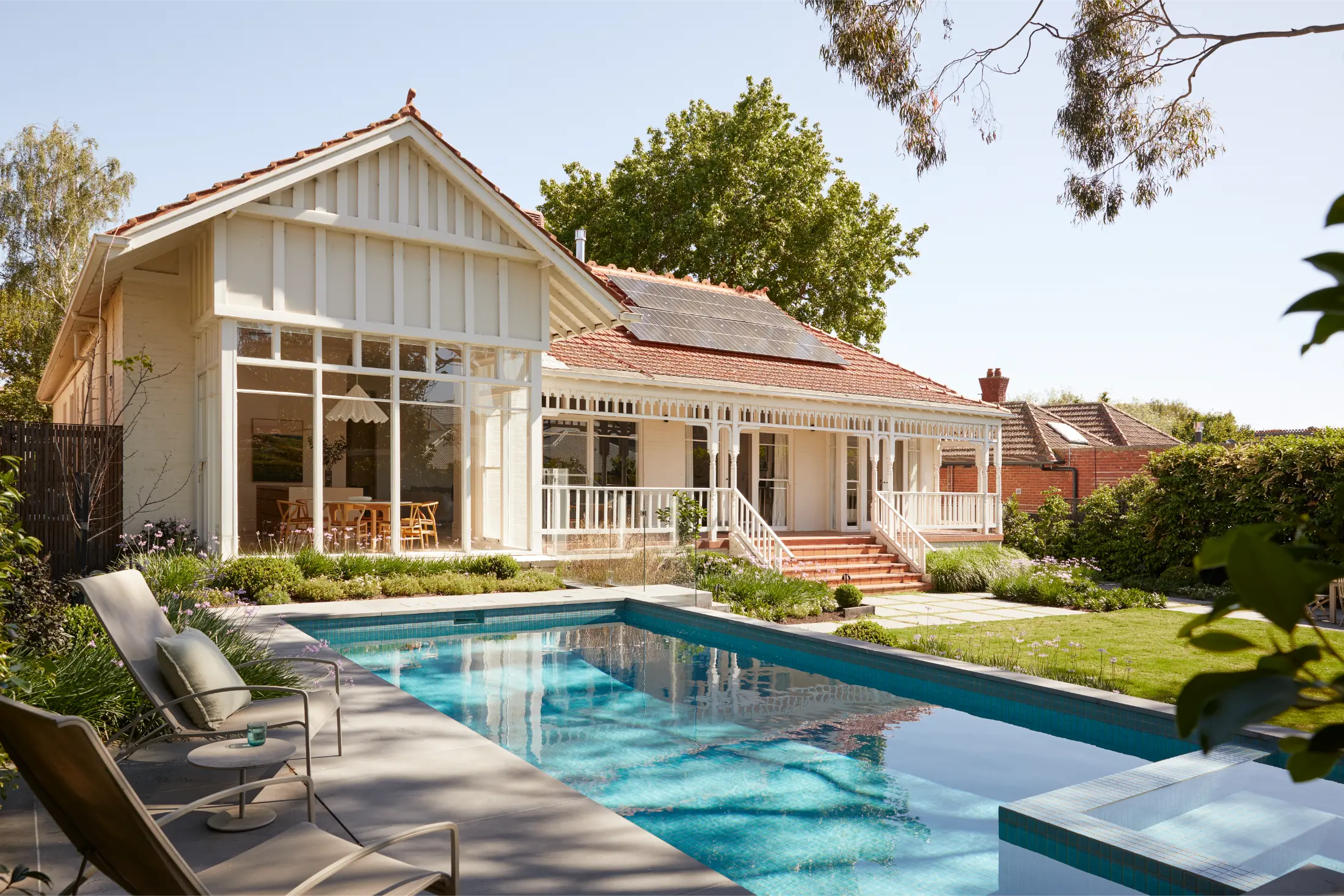 Architectural home in Melbourne with a swimming pool, landscaped garden, and outdoor living area.